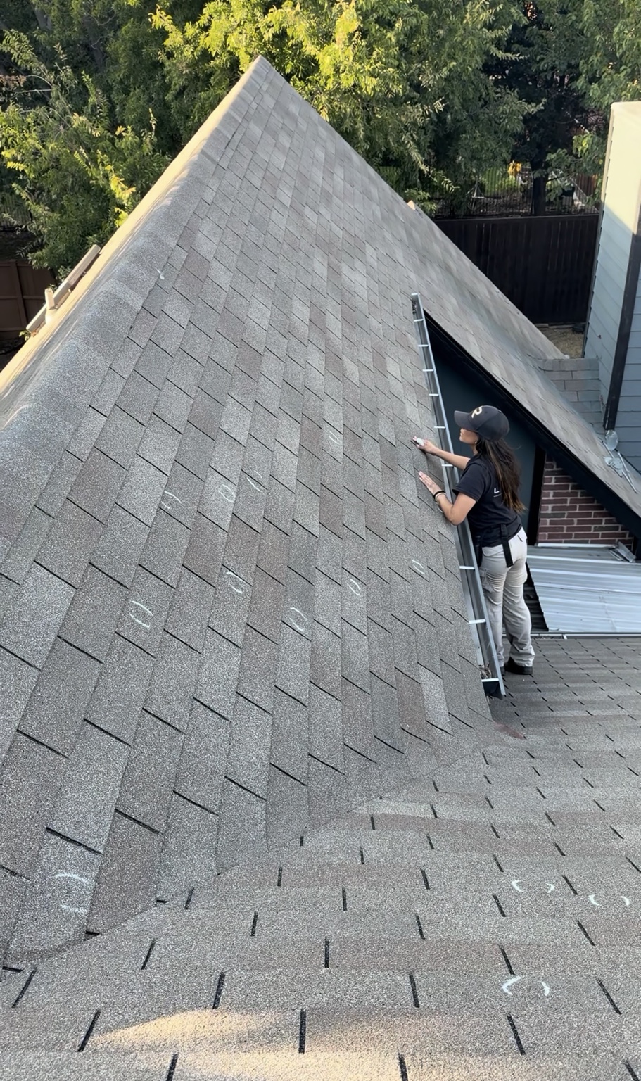 Lori inspecting and documenting visible roof conditions