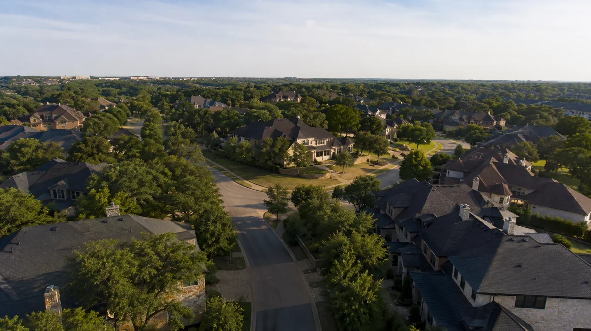 Aerial view of a tree-lined residential neighborhood