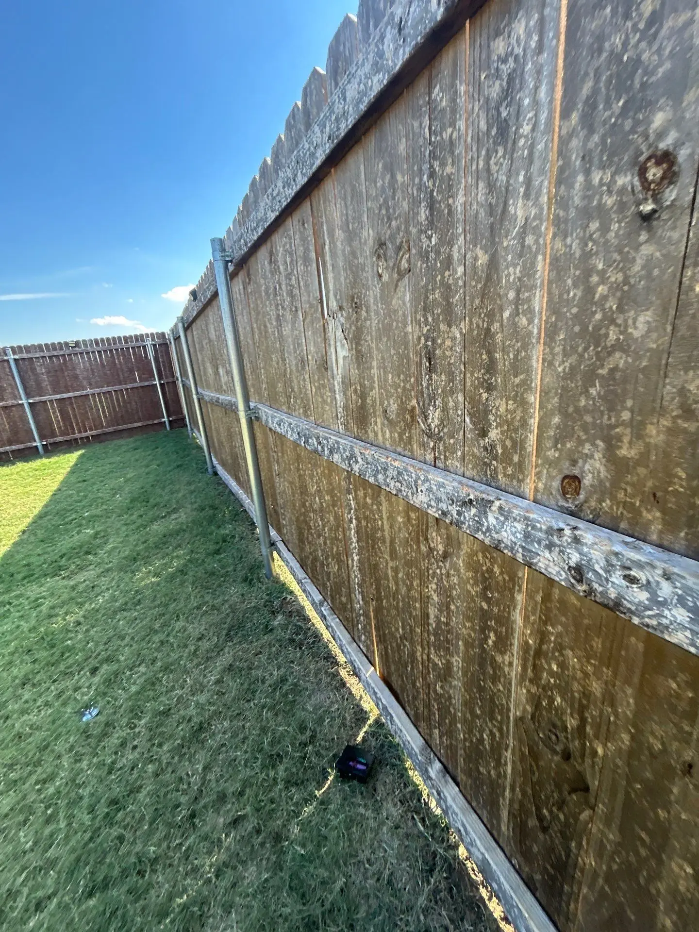 Surface marks across a wooden fence